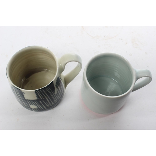 514 - A set of 2 studio pottery mugs by local ceramicist Adam Frew.