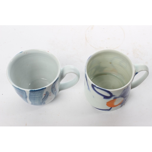 515 - A set of 2 studio pottery mugs by local ceramicist Adam Frew.