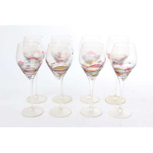 533 - A set of 8 decorative wine glasses.