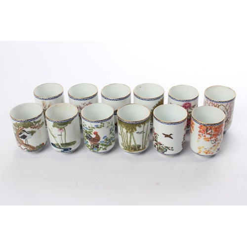 535 - A set of 12 decorative ceramic cups.