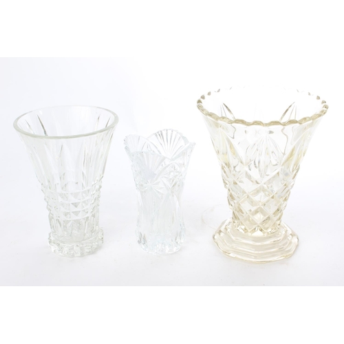 536 - A lot of three vintage glass vases Measuring 17cm, 20cm and 22cm tall.