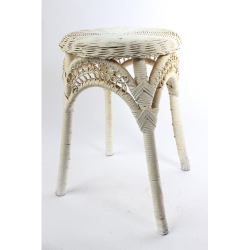 543 - A vintage painted rattan stool.