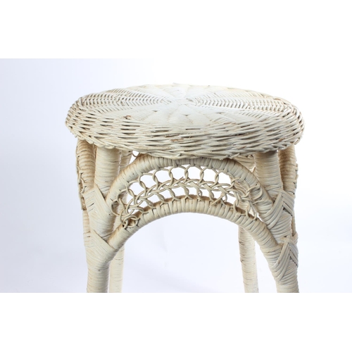 543 - A vintage painted rattan stool.