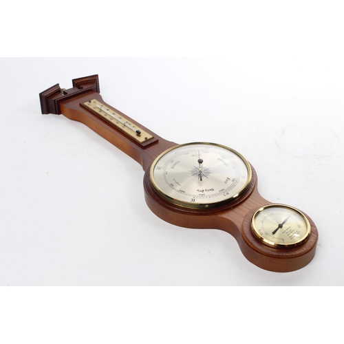 547 - A wall mounted barometer.