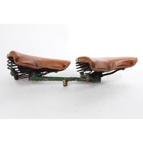 549 - A rare Terry Spring double bicycle saddle seat combination. Each of the two brown leather seats meas... 