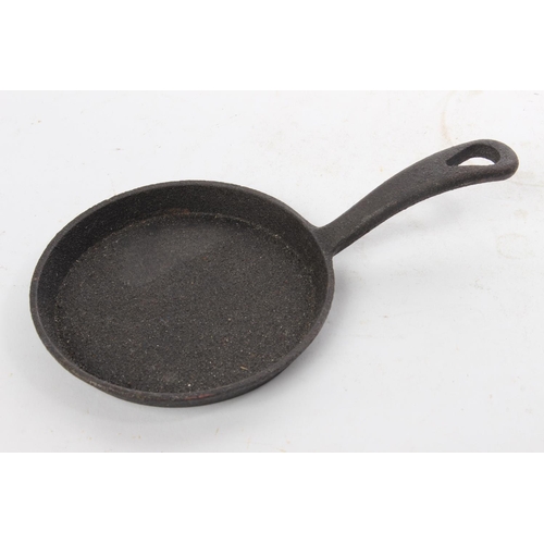 552 - A small cast iron pan.