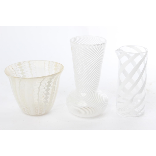 554 - Three decorative glass vases.