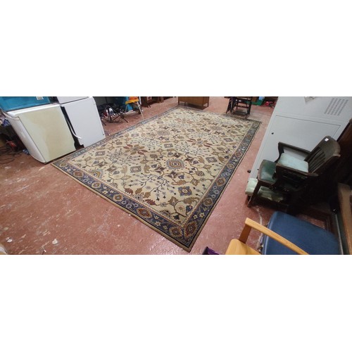 233 - A large vintage patterned floor rug.