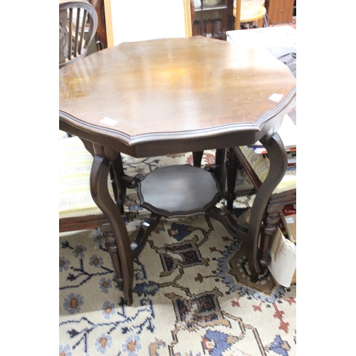 261 - A mahogany and inlay centre table with undershelf.