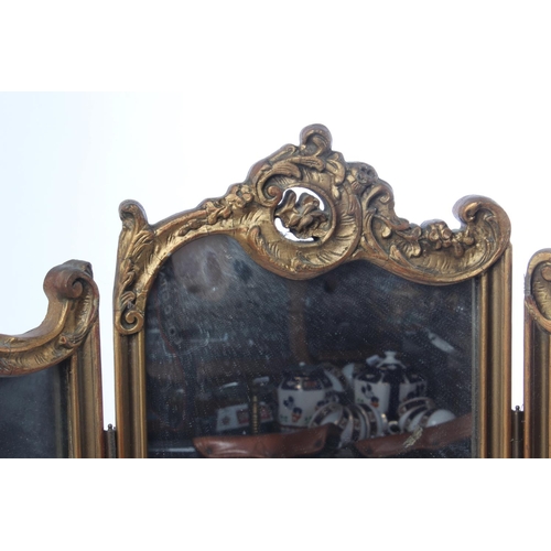 390 - An antique gilt framed triple dressing table mirror.