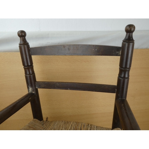 426 - A child's rattan seat chair (a/f).