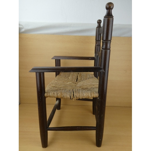 426 - A child's rattan seat chair (a/f).