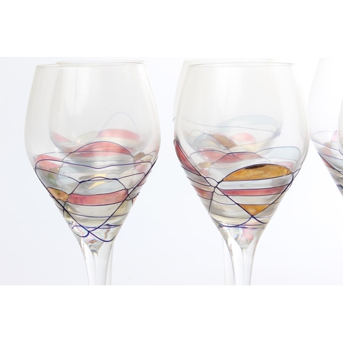 533 - A set of 8 decorative wine glasses.