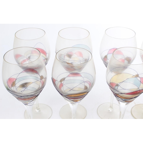 533 - A set of 8 decorative wine glasses.