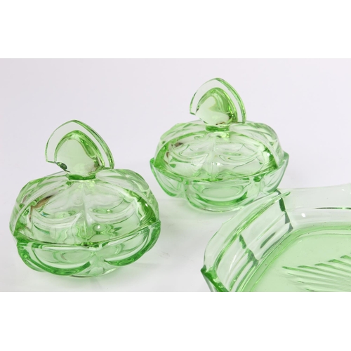 A vintage green glass dressing table set.