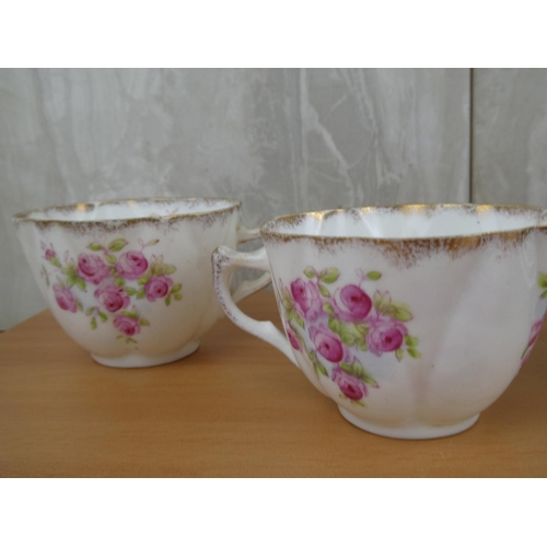 179 - An antique Wellington bone china tea set.