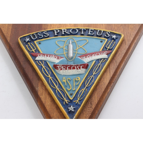 270 - A metal and wood 'USS Proteus' wall plaque.