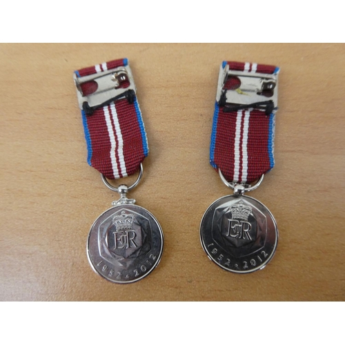 428 - Two Queens Diamond Jubilee medals (one a/f).