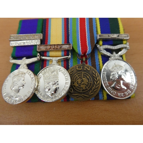 441 - A set of four miniature medals to include General Service medal, Northern Ireland/Saudi Arabia Golf ... 