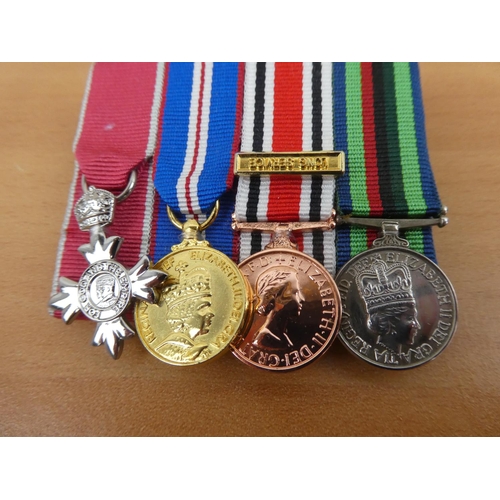 443 - A set of four miniature medals to include an RUC Service Medal, an Ulster Special Constabulary Long ... 