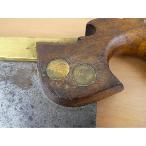 469 - A vintage W Tyzack Sons & A Turner handsaw with brass detail.