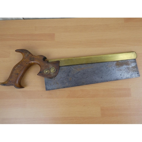 469 - A vintage W Tyzack Sons & A Turner handsaw with brass detail.