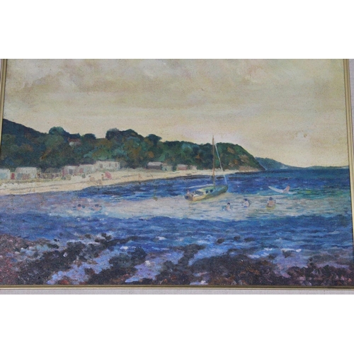 503 - A framed oil painting of a beach scene signed bottom right hand corner.