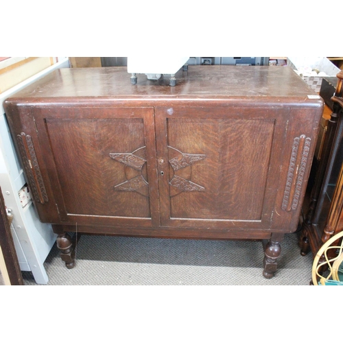 532 - A vintage oak sideboard with carved detail.