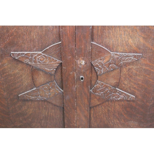 532 - A vintage oak sideboard with carved detail.