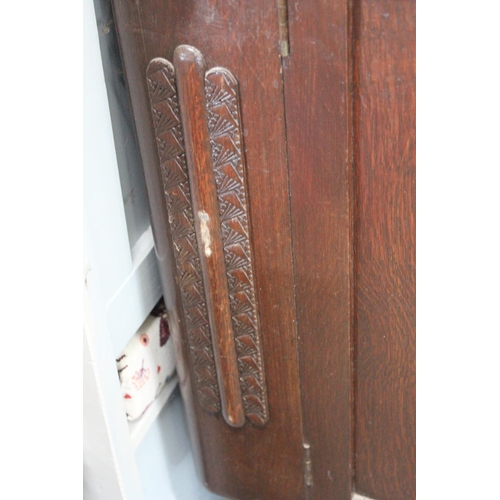 532 - A vintage oak sideboard with carved detail.