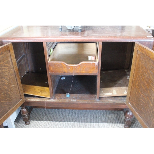 532 - A vintage oak sideboard with carved detail.