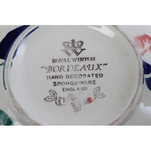 588 - A large lot of Royal Winton 'Bordeaux' hand decorated spongeware pottery.