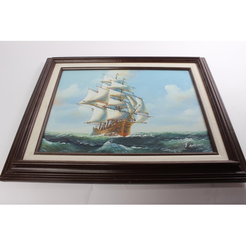 599 - A framed print of a sailing ship, signed.