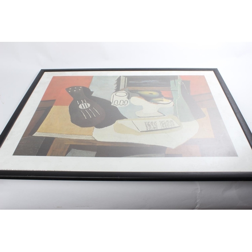 604 - A framed Pablo Picasso print, 'Guitar, Glass and Dish with Fruit, published by Shorewood Reproductio... 