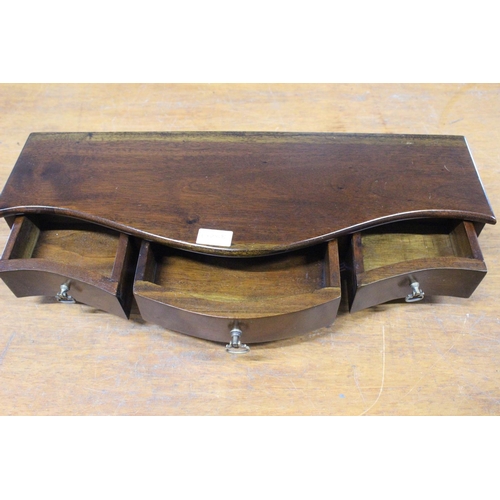 637 - A serpentine dressing table mirror base, with three drawers.