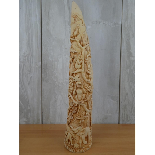 675 - A resin tusk with decoratively carved details.