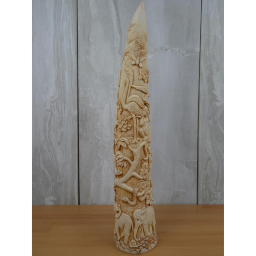 675 - A resin tusk with decoratively carved details.