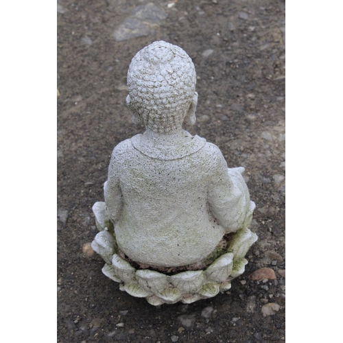 27 - A garden Buddha figure.