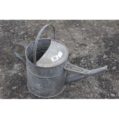 32 - A vintage galvanised watering can.