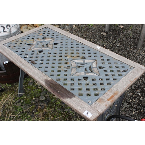 35 - A garden table with cast iron top panel & ends.