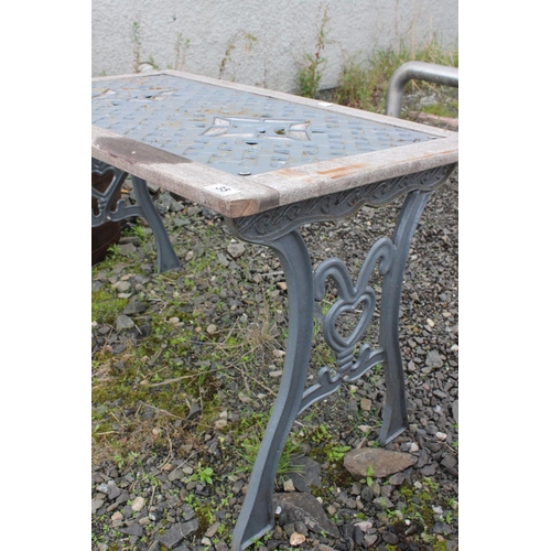 35 - A garden table with cast iron top panel & ends.