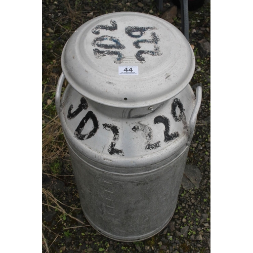 44 - A vintage galvanised 'Grundy' milk churn with lid.