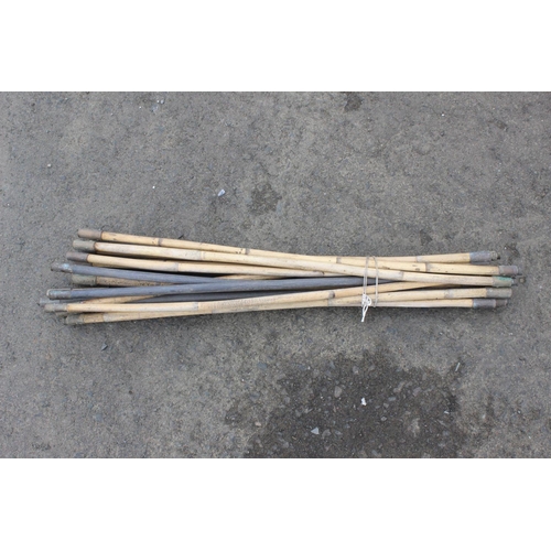 52 - A collection of bamboo sewer rods.