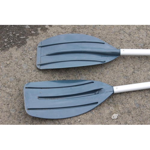 54 - A pair of paddles/ oars.