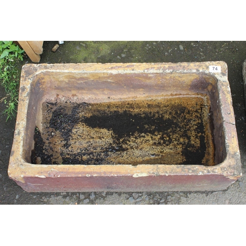 74 - An antique Belfast style clay sink, measuring 70cm x 39cm.