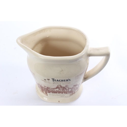 128 - An antique Seaton Pottery Teacher's Highland Cream Scotch Whisky pub jug.