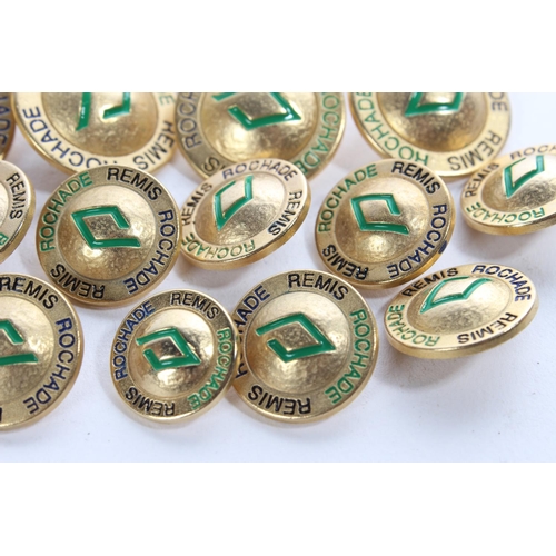 146 - A lot of vintage gold coloured metal and enamel Rochade Remis Designer buttons.