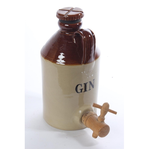 150 - A 'Gin' stoneware flagon and tap.