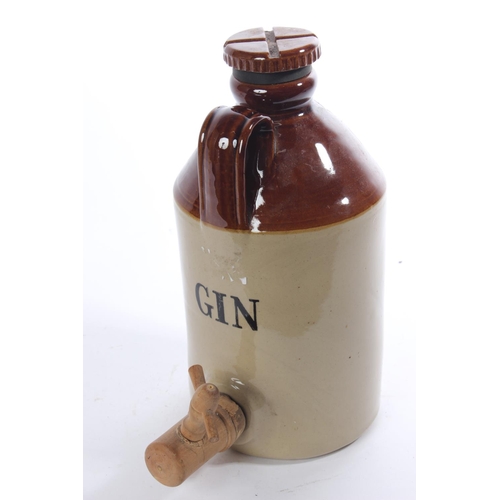 150 - A 'Gin' stoneware flagon and tap.