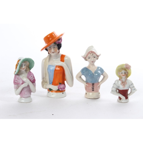 167 - A collection of 4 antique porcelain half dolls.